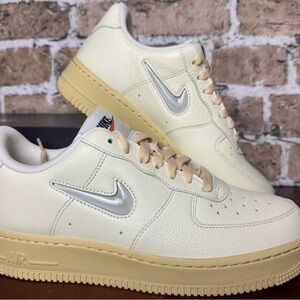 Nike Low-Top Sneakers in Ivory with Yellowed Sole and Silver Swoosh